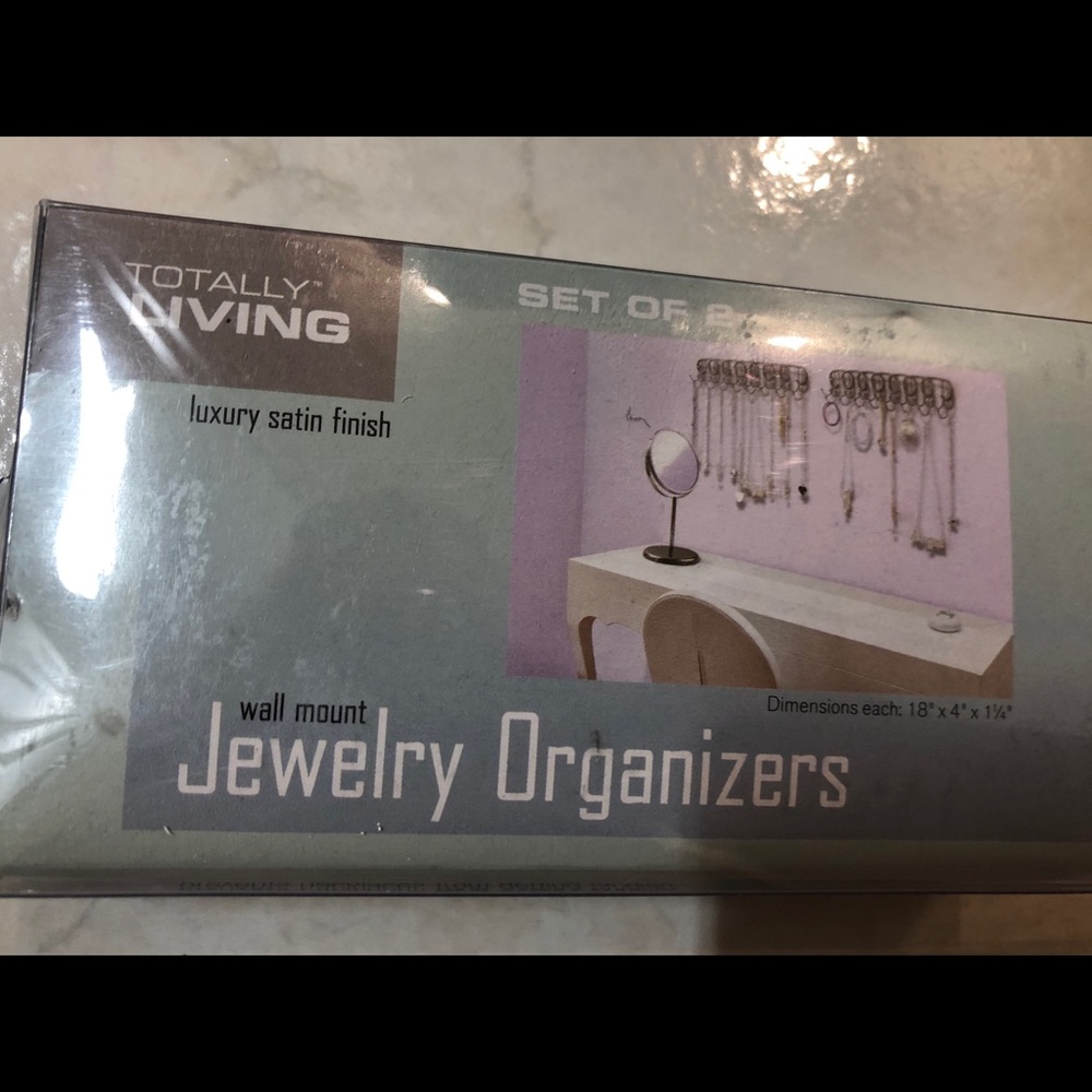 ONE jewelry organizer (hangs on wall)
